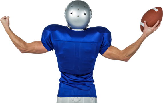 American football player flexing muscles while holding ball