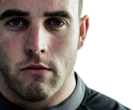 Tough rugby player looking at camera