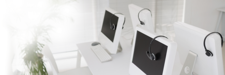 Desktop computers with headphones on desk