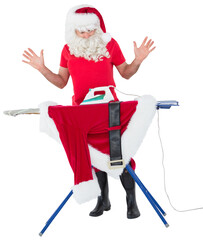 Surprised santa claus ironing his jacket