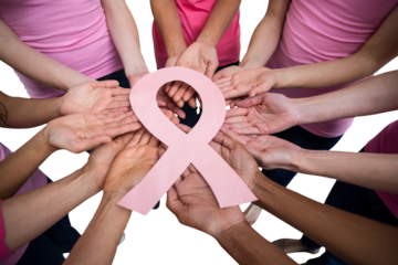 High angle view of women in pink outfits holding breast cancer awareness ribbon
