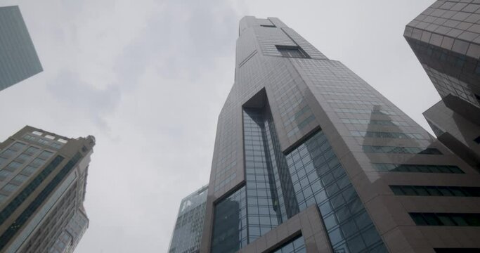 Camera Looking Up Huge Skyscrapers In Business District, Rotating Around