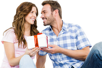 Man giving gift to woman