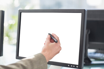 Hand pointing towards computer screen