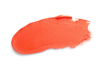 Stroke of coral lipstick on white background