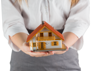 Businesswoman holding model house