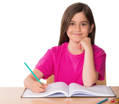 Cute pupil working at her desk