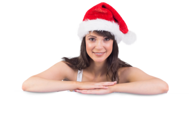 Festive brunette leaning on large poster