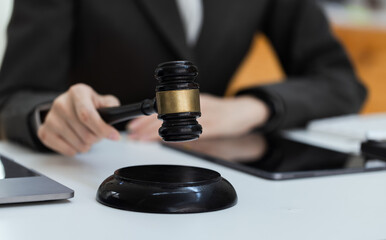 Asian lawyer woman working at law office desk, law firms, advice and justice concept.