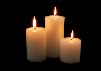Fototapeta na wymiar Three big whole candles burning on black background.
