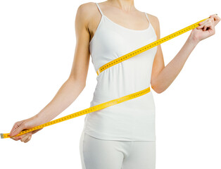 Midsection of slim woman measuring her waist