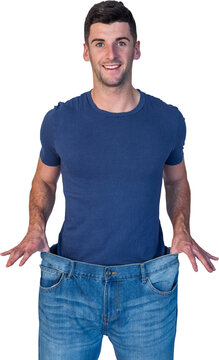 Fototapeta Handsome man showing loose denim jeans
