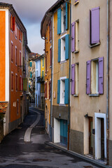 Fototapeta na wymiar narrow village street in the center of Castellane with colourful houses