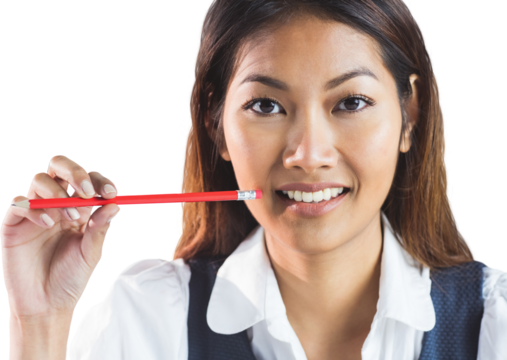 Smiling businesswoman holding a pencil - Powered by Adobe