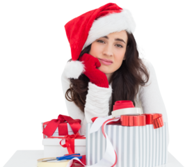Unsure brunette in santa hat packing gifts