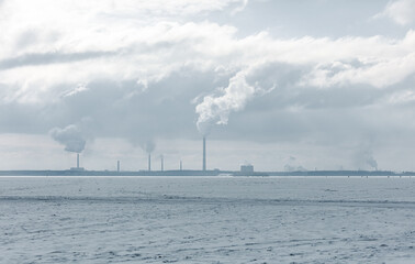 From the pipes of a metallurgical plant against the sky. Production.