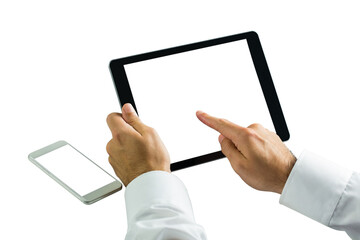 Businessman using digital tablet next to smartphone