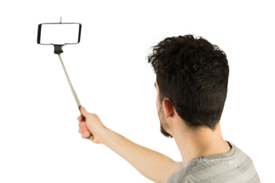 Casual man using a selfie stick