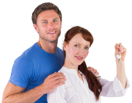 Couple holding keys to home