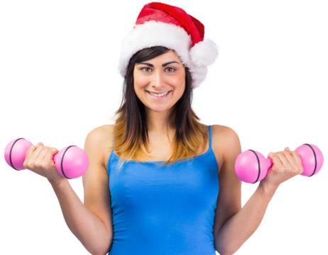 Festive fit brunette holding dumbbells - Powered by Adobe