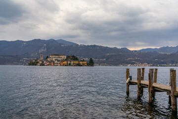 view of Lake Orta and the Isola San Guilio islet with its historic buildings
