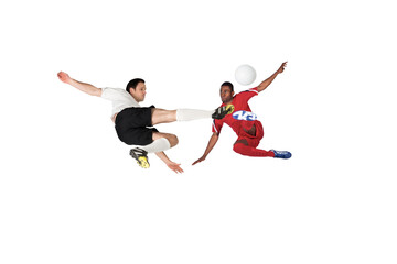 Fototapeta na wymiar Football players tackling for the ball
