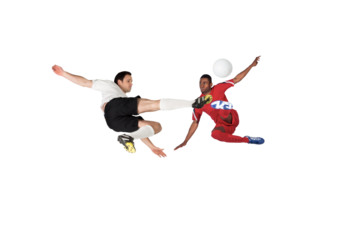 Football players tackling for the ball