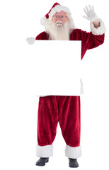 Naklejka premium Santa holds a sign and is waving