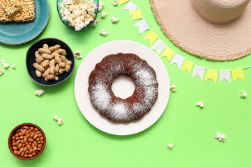 Traditional food with hat and flags for Festa Junina (June Festival) on green background