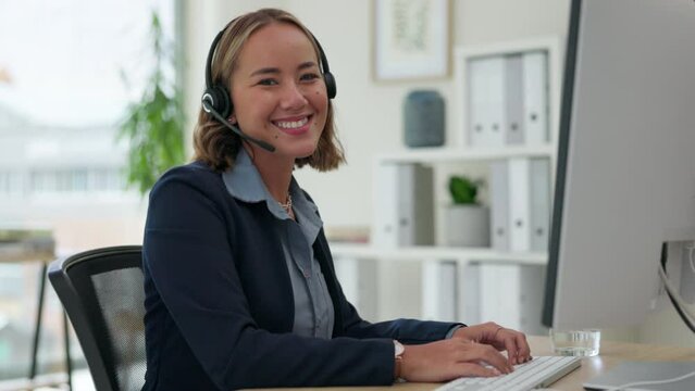Asian woman, call center and face with headphones typing on computer for customer service or support. Portrait of happy female consultant or agent on PC with headset for online advice at workplace