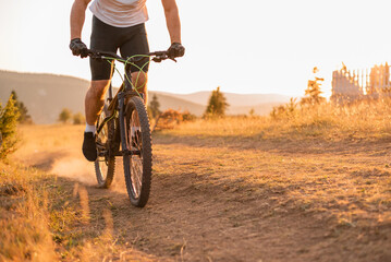 Professional mountain bike cyclist riding enduro trail track adventure sport outdoor. 