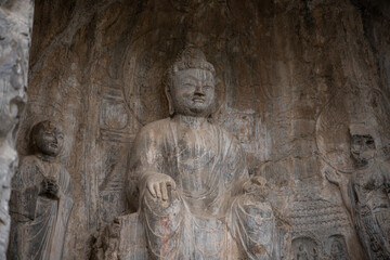 Carved Buddha Limestone at Longmen Grottoes or Caves (Dragon gate Grottoes), The World Heritage Site in Luoyang, Henan province, China. Selective focus