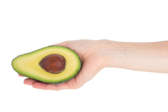 Woman presenting half of an avocado  - Powered by Adobe