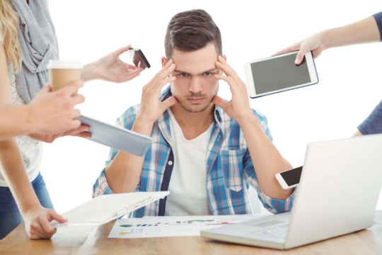 Tensed businessman with head in hand