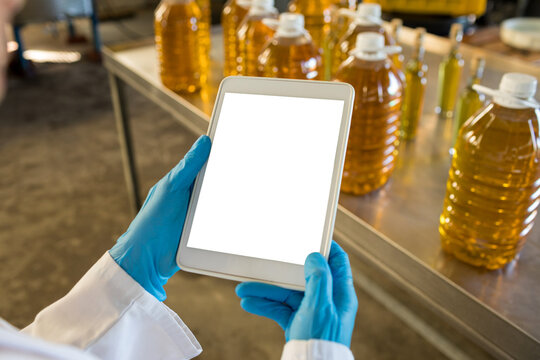 Cropped hands of technician using digital tablet