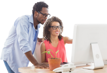 Business people using computer at desk
