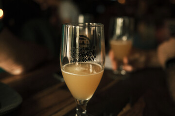 Close-up view of a craft beer in a port glass on the bar counter