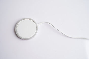 Wireless charger, magnetic charging modern equipment of mobile phone. © manassanant