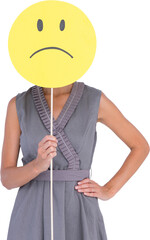 Woman holding sad smiley in front of face