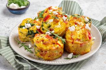 Delicious egg muffins with pepper, feta cheese and spinach