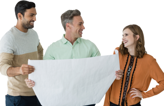 Smiling business people discussing blueprint against white background