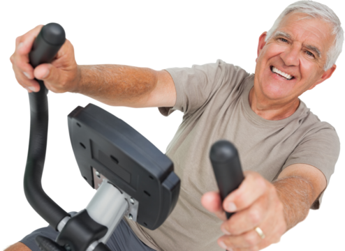 Portrait of a happy senior man on stationary bike - Powered by Adobe