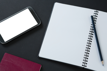 Passport, mobile phone, pencil and organizer on black background