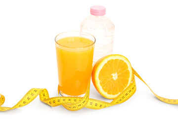 Glass of orange juice and yellow measuring tape on white background. Diet concept