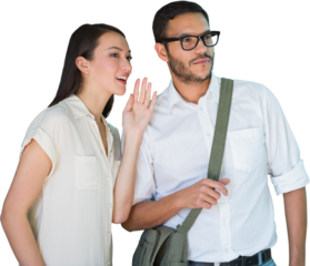 Woman whispering into male friends ear