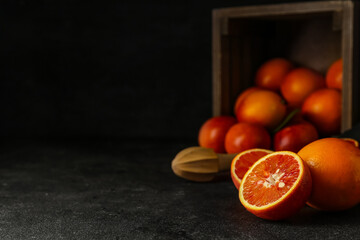 Tasty blood orange fruits on dark background