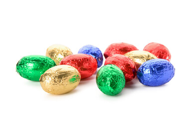 Chocolate Easter eggs in colorful foil isolated on white background
