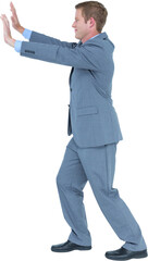Businessman standing and pushing with hands