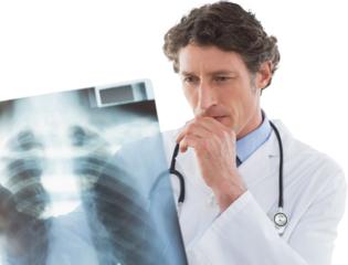 Serious doctor looking at X-ray 