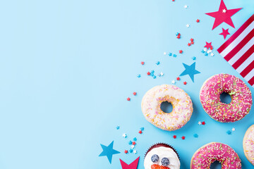 Sweet cupcakes and donuts with usa flag on blue background